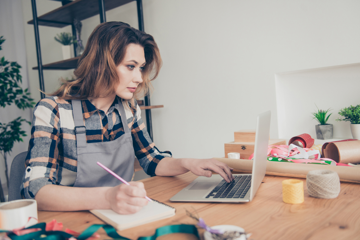 Business owner writing her brand story.